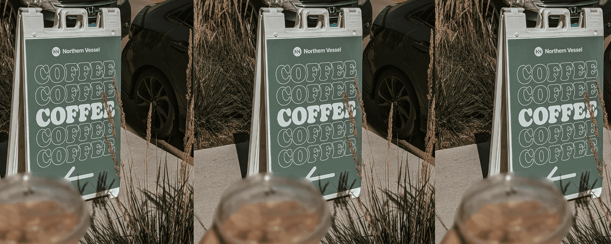 A sidewalk sandwich board sign outside a local storefront
