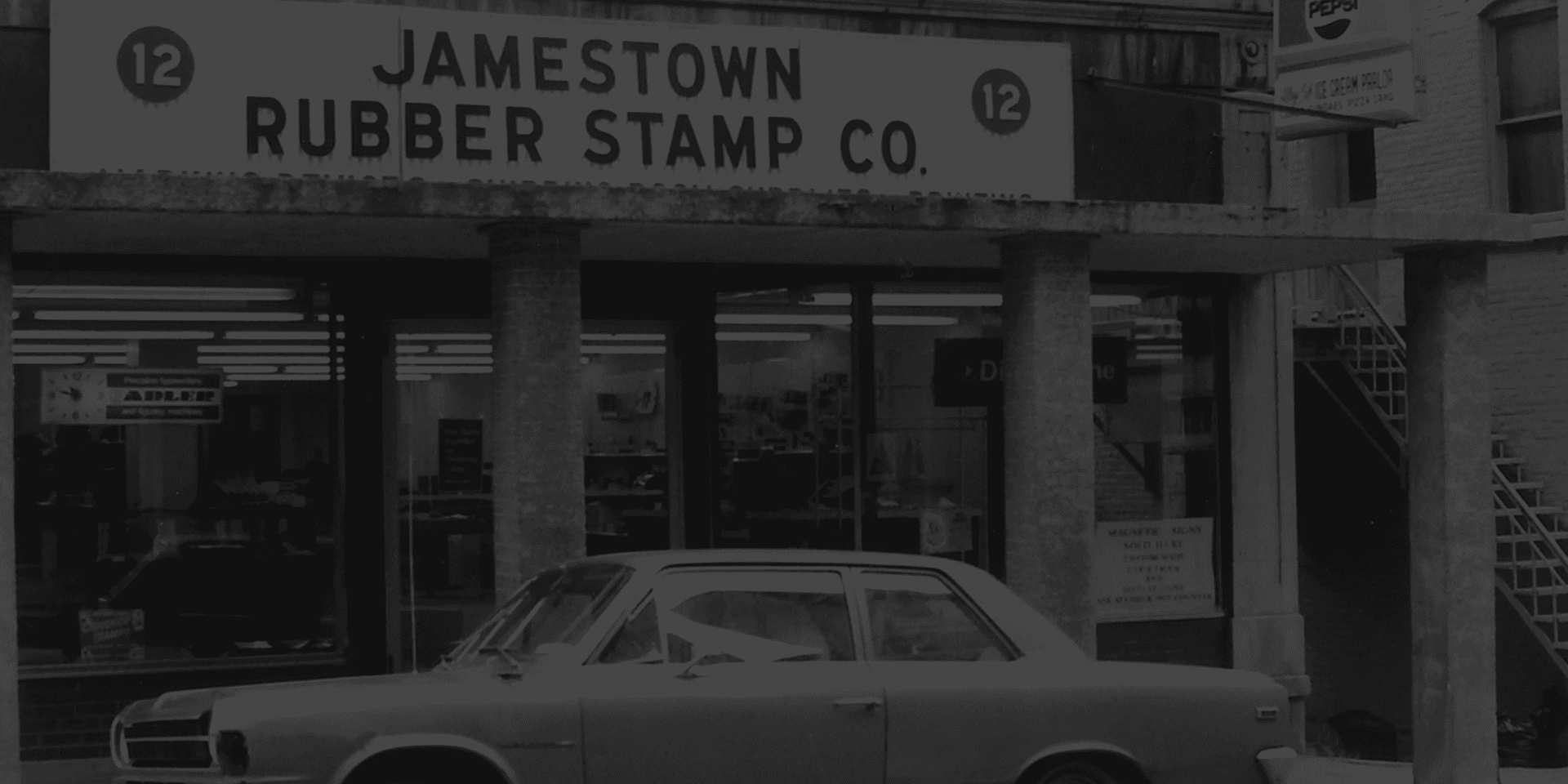 Historic Jamestown Rubber Stamp Company storefront, celebrating 70 years of printing possibilities.
