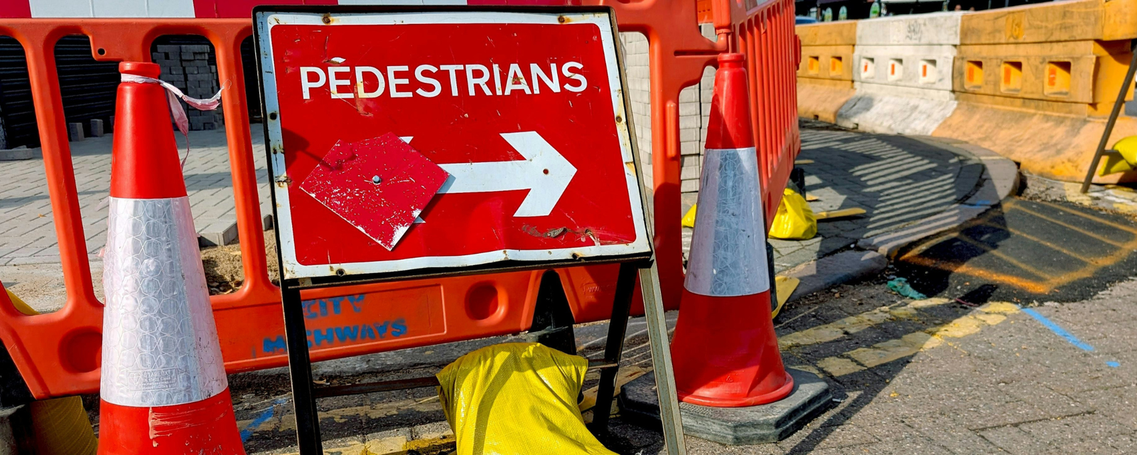 Construction site fence banner and jobsite signage in view